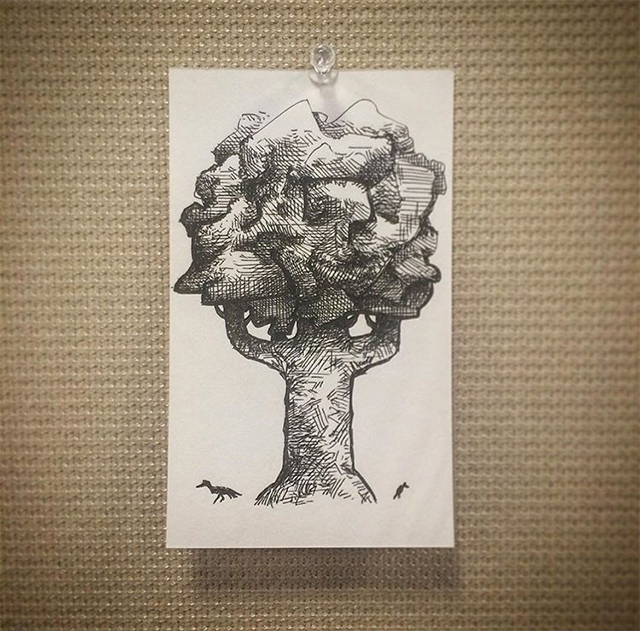 A small illustration of a thick-trucked tree on the back of an index card.